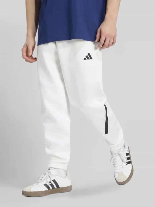 Zdjęcie produktu Spodnie dresowe o kroju regular fit z domieszką bawełny Adidas Biały