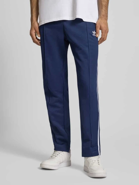 Zdjęcie produktu Spodnie dresowe o kroju regular fit z elastycznym pasem adidas Originals Granatowy
