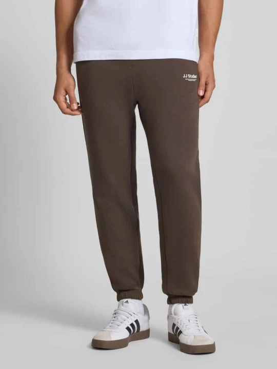 Zdjęcie produktu Spodnie dresowe o kroju regular fit z elastycznym pasem model ‘KANE’ Jack&Jones Ciemnobrązowy