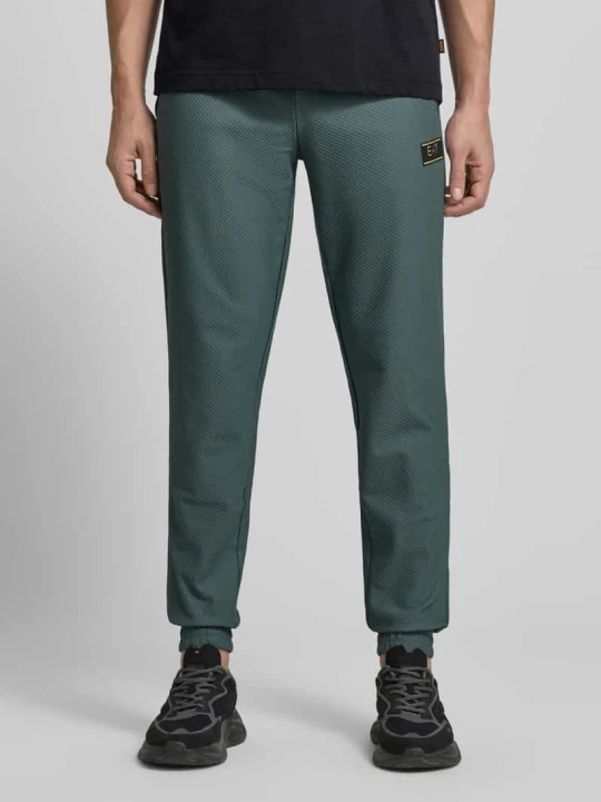 Zdjęcie produktu Spodnie dresowe o kroju regular fit z fakturowanym wzorem EA7 Emporio Armani Zielony