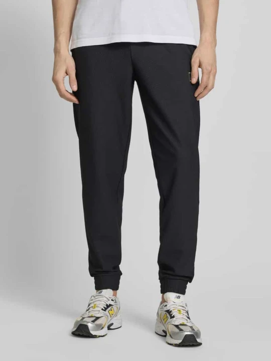 Zdjęcie produktu Spodnie dresowe o kroju regular fit z fakturowanym wzorem EA7 Emporio Armani Czarny