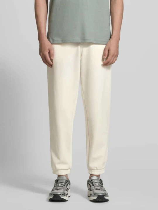 Zdjęcie produktu Spodnie dresowe o kroju regular fit z kieszeniami z tyłu model 'Pantaloni' Armani Exchange Złamany biały