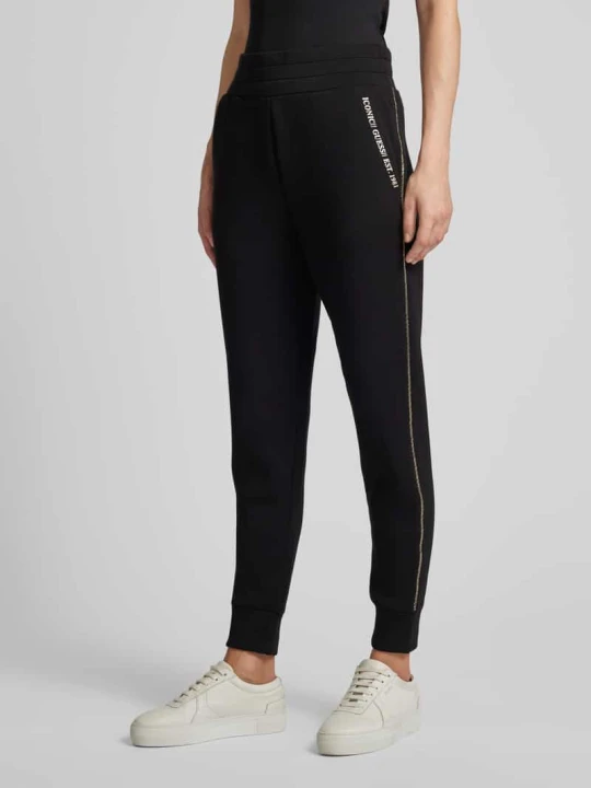 Zdjęcie produktu Spodnie dresowe o kroju regular fit z lampasami model ‘SIMONNE’ Guess Czarny