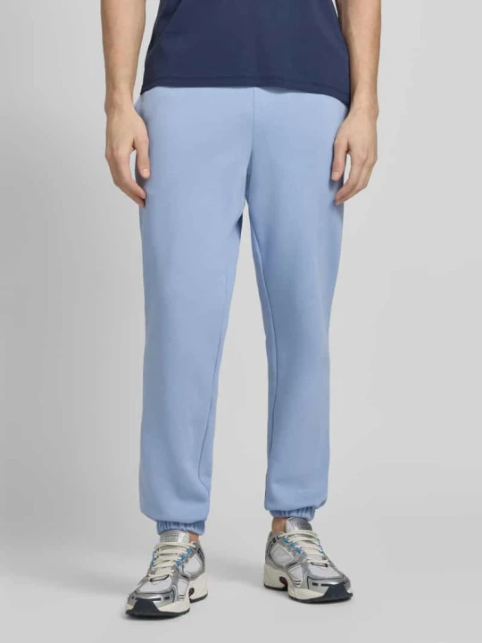 Zdjęcie produktu Spodnie dresowe o kroju regular fit z mieszanki bawełny Lacoste Błękitny