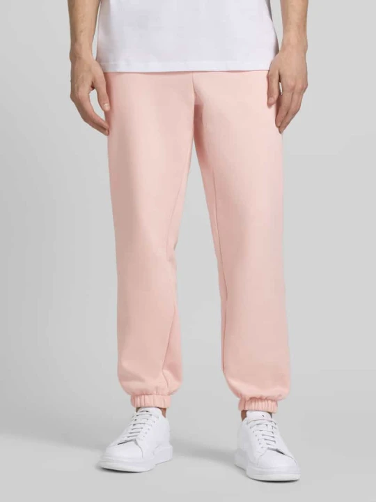 Zdjęcie produktu Spodnie dresowe o kroju regular fit z mieszanki bawełny Lacoste Różowy