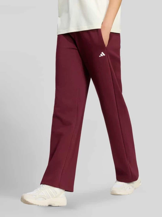 Zdjęcie produktu Spodnie dresowe o kroju regular fit z mieszanki bawełny model 'W SL FC PT' Adidas Bordowy