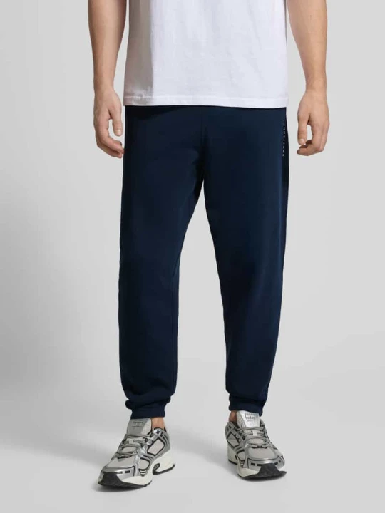 Zdjęcie produktu Spodnie dresowe o kroju regular fit z mieszanki bawełny Tommy Jeans Granatowy