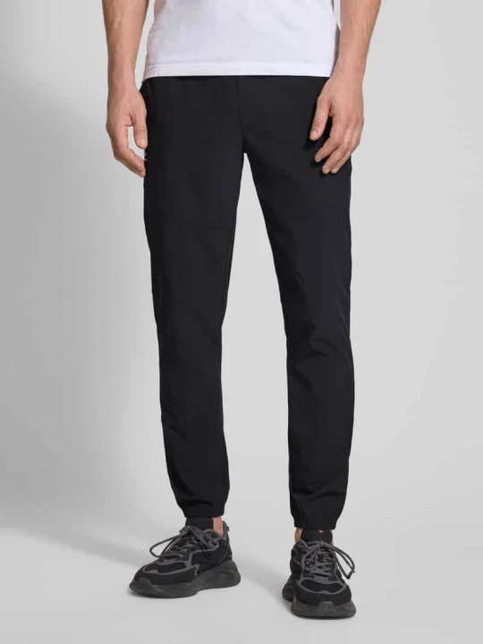 Zdjęcie produktu Spodnie dresowe o kroju regular fit z nadrukiem z logo model 'Vibe' Under Armour Czarny