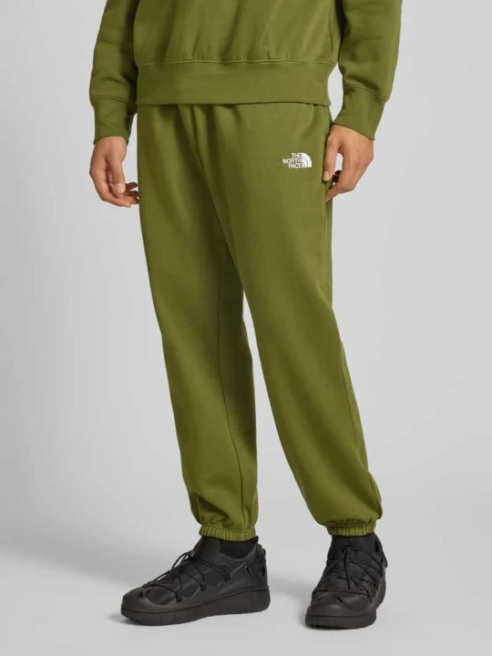 Zdjęcie produktu Spodnie dresowe o kroju regular fit z wyhaftowanym logo The North Face Oliwkowy
