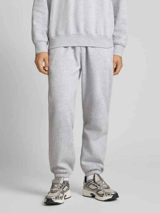 Zdjęcie produktu Spodnie dresowe o kroju regular fit z wyhaftowanym logo The North Face Jasnozielony melanż