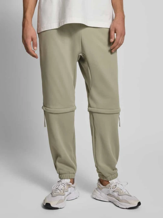 Zdjęcie produktu Spodnie dresowe o kroju relaxed fit z nadrukiem z logo Adidas Trzcinowy