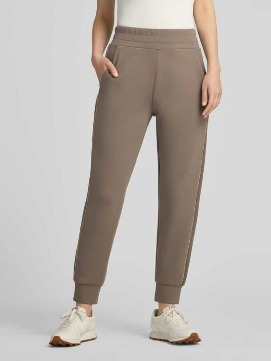 Zdjęcie produktu Spodnie dresowe o kroju slim fit z dodatkiem wiskozy model 'Victoire' Guess