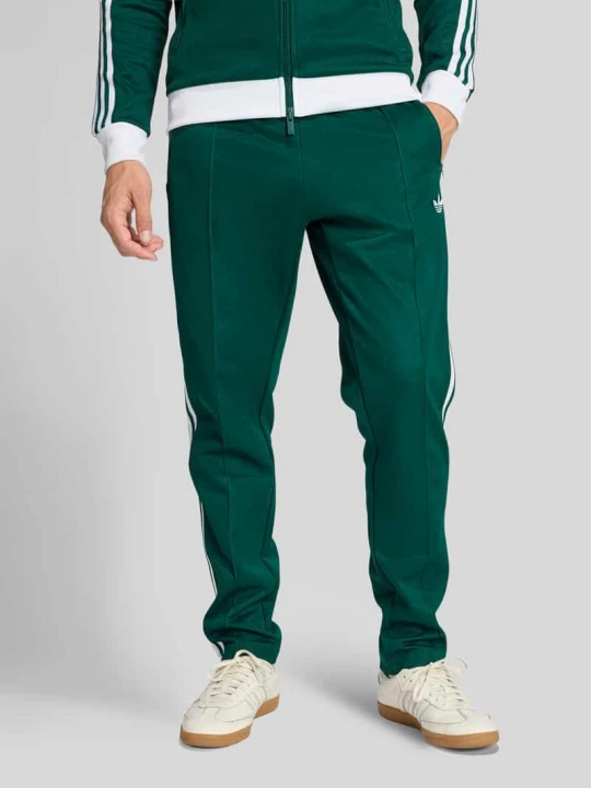 Zdjęcie produktu Spodnie dresowe o kroju slim fit z mieszanki bawełny adidas Originals Ciemnozielony