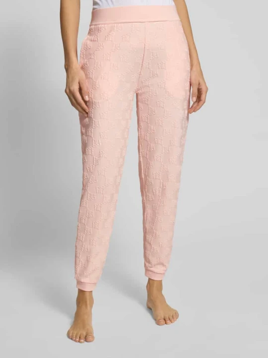 Zdjęcie produktu Spodnie dresowe o kroju slim fit z mieszanki bawełny model „TERRYMONOGRAM” Hugo Różowy