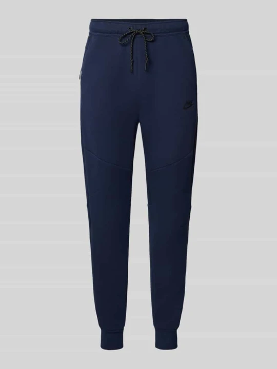 Zdjęcie produktu Spodnie dresowe o kroju slim fit z mieszanki bawełny Nike Ciemnoniebieski