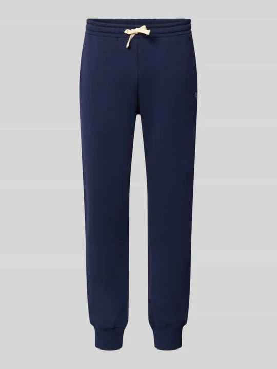 Zdjęcie produktu Spodnie dresowe o kroju slim fit z mieszanki bawełny REVIEW Granatowy