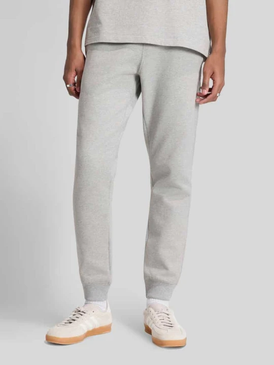 Zdjęcie produktu Spodnie dresowe o kroju slim fit z nadrukiem z logo adidas Originals Jasnoszary melanż