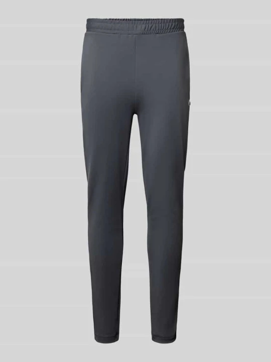 Zdjęcie produktu Spodnie dresowe o kroju slim fit z naszywką z logo Lacoste Ciemnoszary
