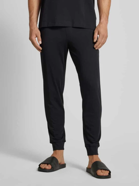 Zdjęcie produktu Spodnie dresowe o kroju slim fit z naszywką z logo model ‘Laze’ Hugo Czarny