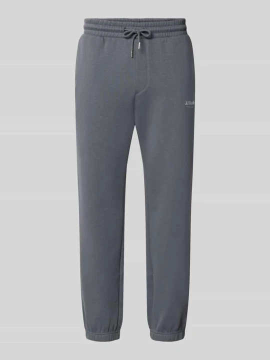 Zdjęcie produktu Spodnie dresowe o kroju straight fit z mieszanki bawełny model 'Kane' Jack&Jones Jasnoszary
