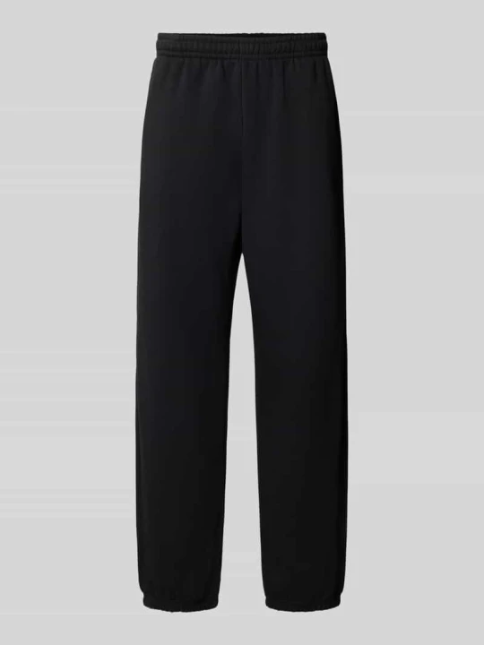 Zdjęcie produktu Spodnie dresowe o kroju straight fit z mieszanki bawełny z wpuszczanymi kieszeniami Urban Classics czarny