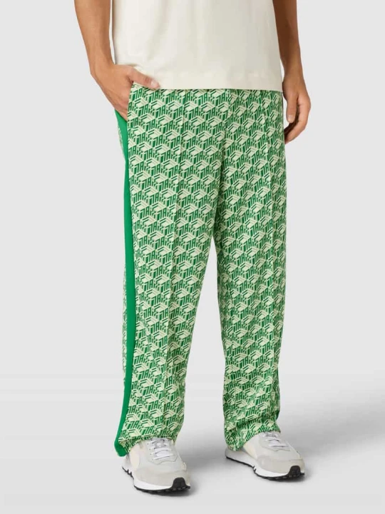 Zdjęcie produktu Spodnie dresowe o kroju straight fit z tunelem Puma Zielony