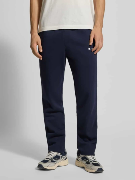 Zdjęcie produktu Spodnie dresowe o kroju straight fit z wyhaftowanym logo model ‘Icons’ Champion Granatowy