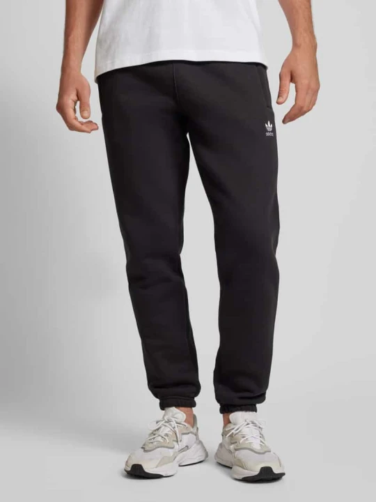 Zdjęcie produktu Spodnie dresowe o kroju tapered fit z wyhaftowanym logo adidas Originals Czarny