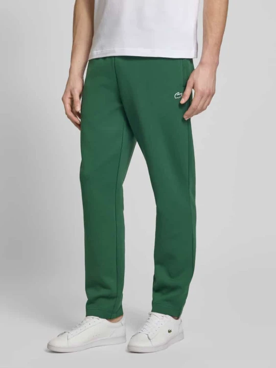 Zdjęcie produktu Spodnie dresowe o kroju tapered z dodatkiem bawełny Lacoste Ciemnozielony