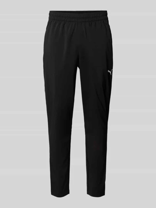 Zdjęcie produktu Spodnie dresowe o kroju tapered z elastycznym pasem model 'TAD ESSENTIALS' Puma Czarny