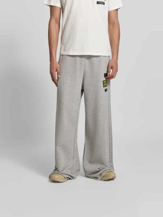 Zdjęcie produktu Spodnie dresowe o kroju wide fit z naszywką z logo MM6 Maison Margiela Średnioszary melanż