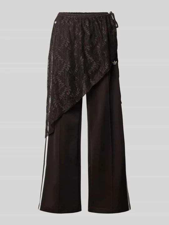 Zdjęcie produktu Spodnie dresowe o luźnym kroju z mieszanka bawełny model '2IN1 LACE FIREBIRD' adidas Originals Ciemnobrązowy