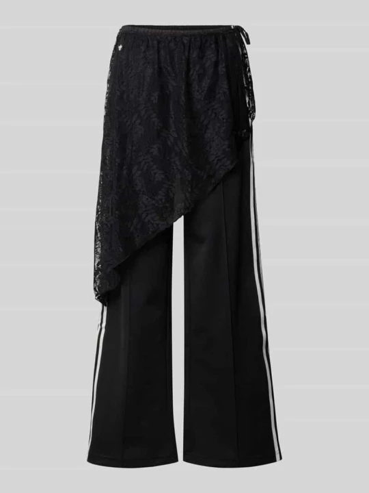 Zdjęcie produktu Spodnie dresowe o luźnym kroju z mieszanka bawełny model '2IN1 LACE FIREBIRD' adidas Originals Czarny