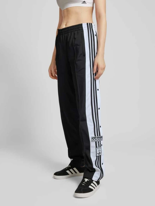 Zdjęcie produktu Spodnie dresowe z bocznymi listwami na zatrzaski model ‘ADIBREAK’ adidas Originals Czarny