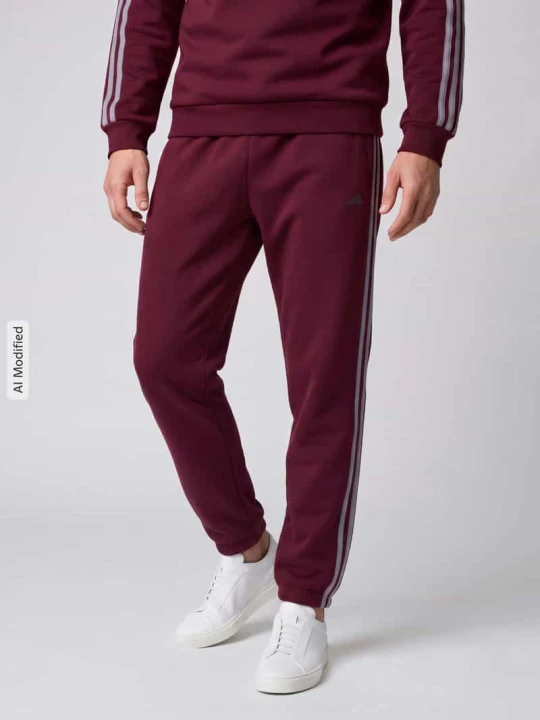 Zdjęcie produktu Spodnie dresowe z bocznymi wpuszczanymi kieszeniami Adidas Ciemnoczerwony