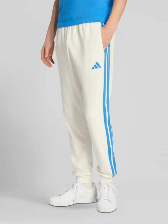 Zdjęcie produktu Spodnie dresowe z detal z logo z mieszanka bawełny Adidas Złamany biały