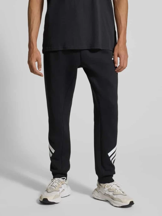 Zdjęcie produktu Spodnie dresowe z elastycznym pasem i logo Adidas Czarny