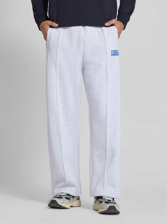 Zdjęcie produktu Spodnie dresowe z elastycznym pasem i nadrukiem z logo Carhartt WIP Jasnoszary melanż