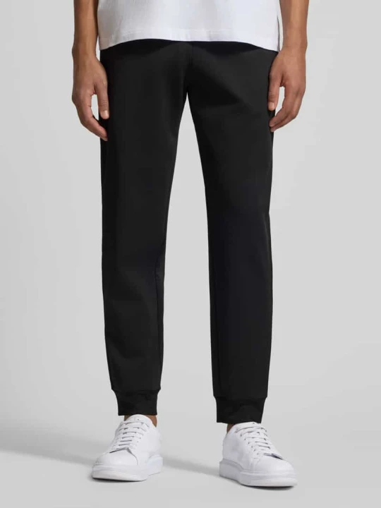 Zdjęcie produktu Spodnie dresowe z elastycznym pasem i naszywką z logo EA7 Emporio Armani Czarny