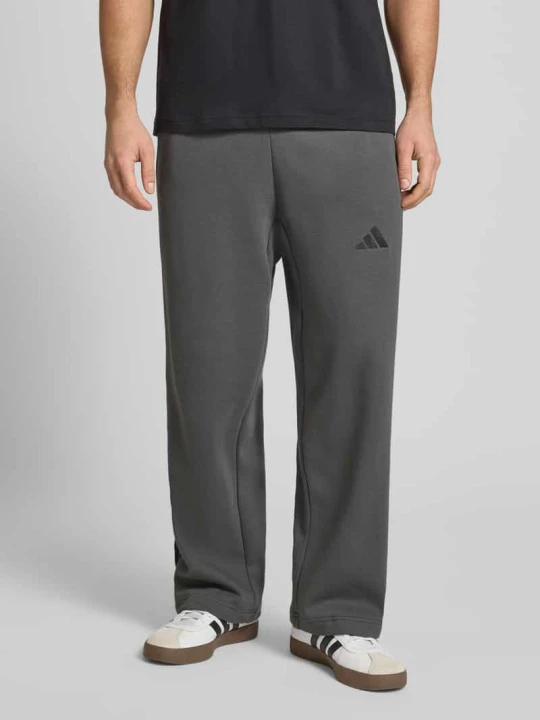 Zdjęcie produktu Spodnie dresowe z elastycznym pasem i tunelem Adidas Antracytowy