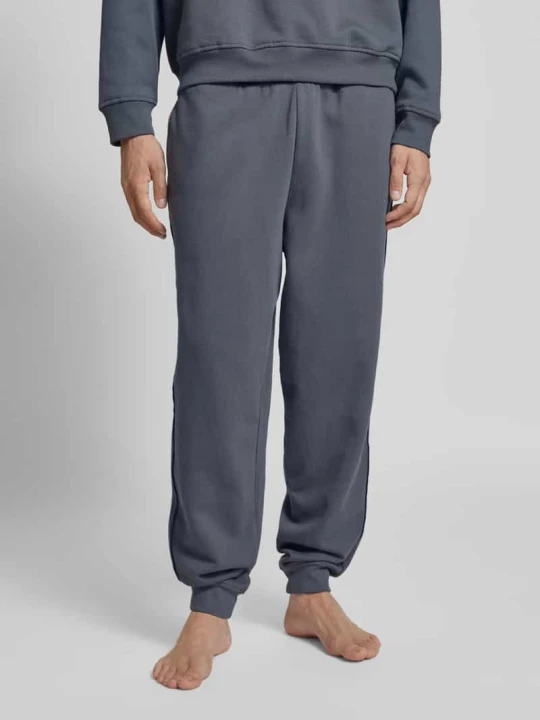 Zdjęcie produktu Spodnie dresowe z elastycznym pasem model ‘JOGGER’ Calvin Klein Jeansowy niebieski