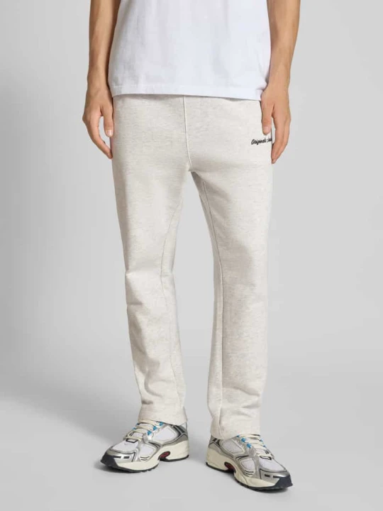 Zdjęcie produktu Spodnie dresowe z elastycznym pasem model ‘KANE’ Jack&Jones Złamany biały melanż