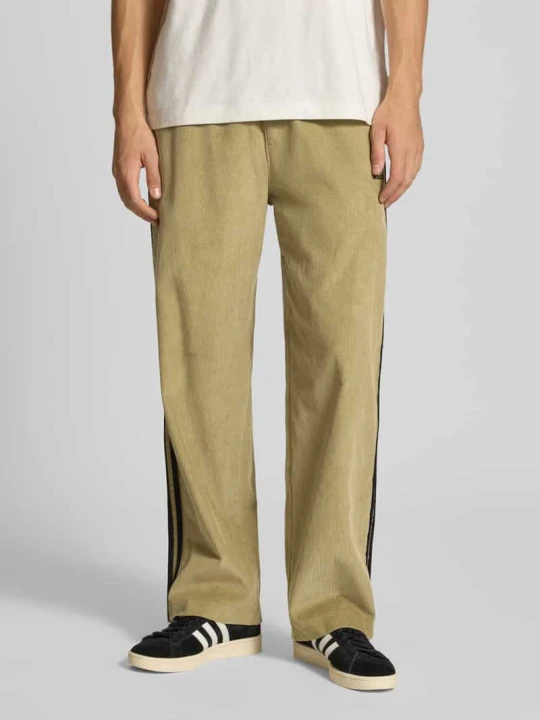 Zdjęcie produktu Spodnie dresowe z elastycznym ściągaczem adidas Originals Khaki