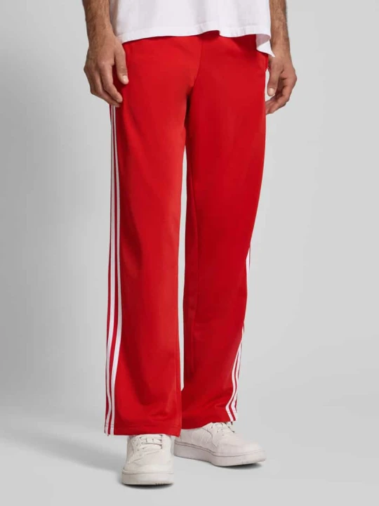 Zdjęcie produktu Spodnie dresowe z elastycznym ściągaczem adidas Originals Czerwony