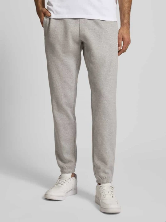 Zdjęcie produktu Spodnie dresowe z elastycznym ściągaczem adidas Originals Jasnoszary melanż