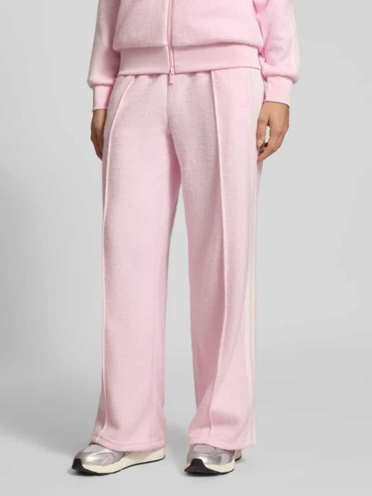 Zdjęcie produktu Spodnie dresowe z elastycznym pasem model "Firebird" adidas Originals Różowy melanż
