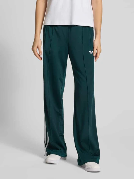 Zdjęcie produktu Spodnie dresowe z elastycznym ściągaczem adidas Originals Ciemnozielony