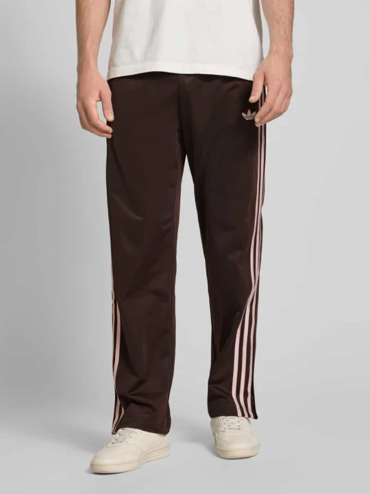 Zdjęcie produktu Spodnie dresowe z elastycznym pasem adidas Originals Ciemnobrązowy