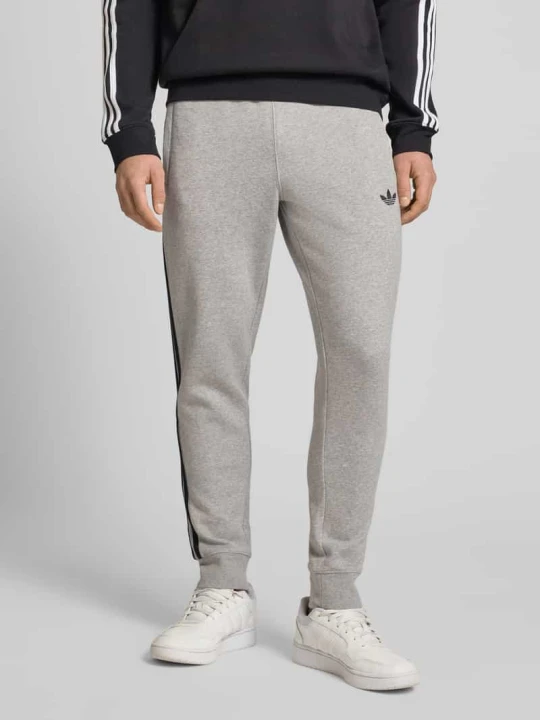 Zdjęcie produktu Spodnie dresowe z elastycznym pasem adidas Originals Jasnoszary melanż