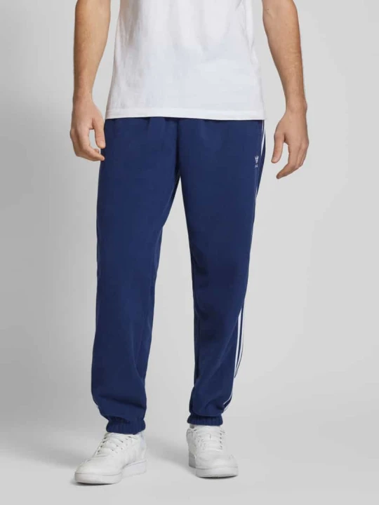 Zdjęcie produktu Spodnie dresowe z elastycznym ściągaczem adidas Originals Granatowy